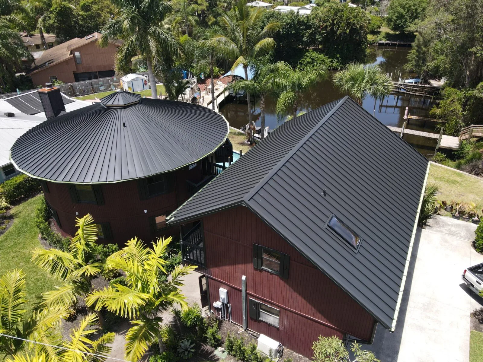 Aerial view of Florida homes with black metal roofs