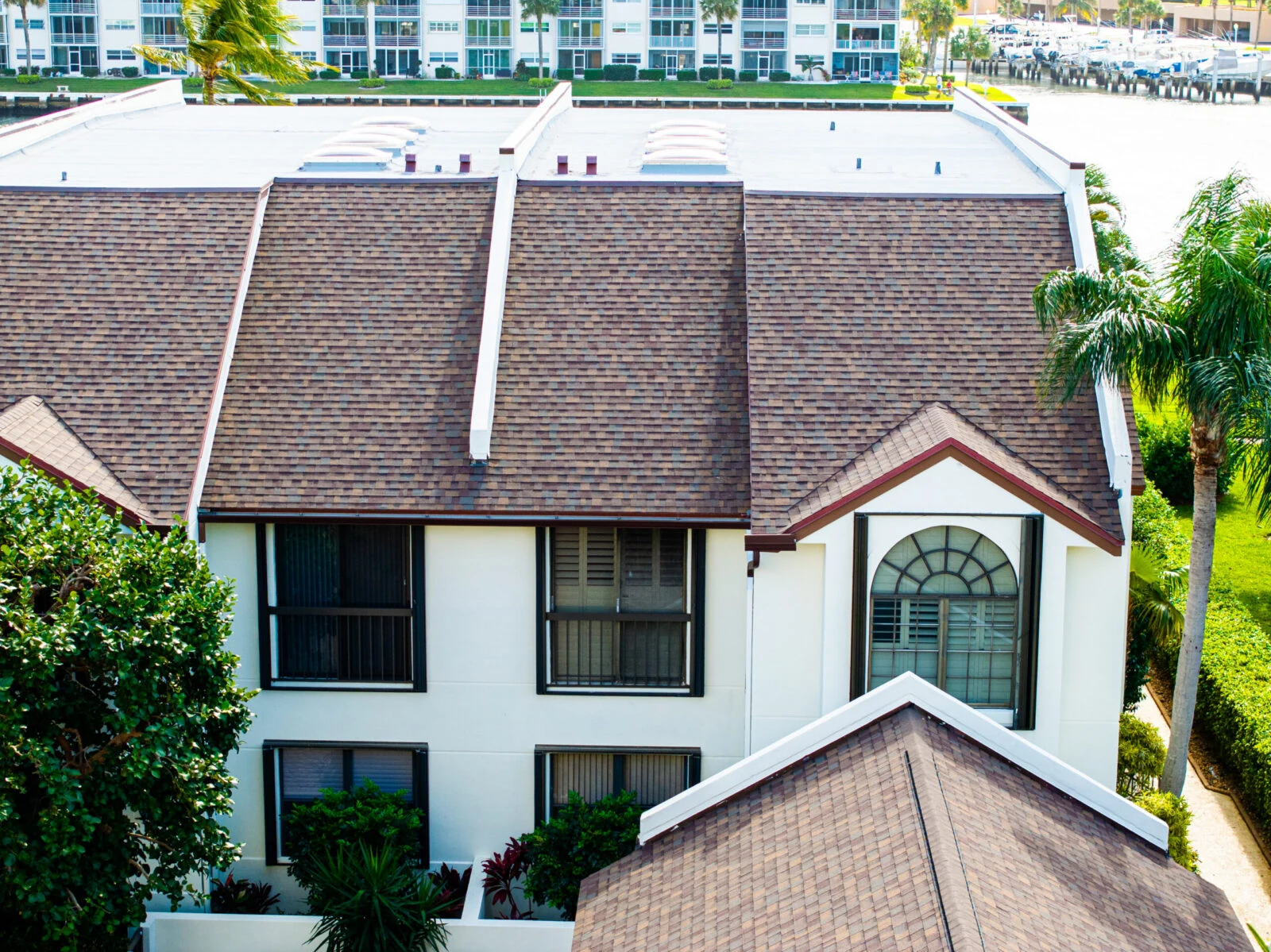Florida home with a brown architectural shingle gable roof
