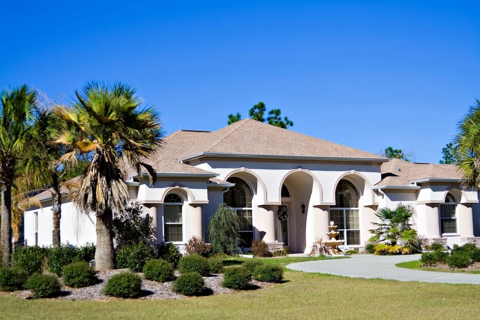 Florida home with a tan asphalt shingle hip roof