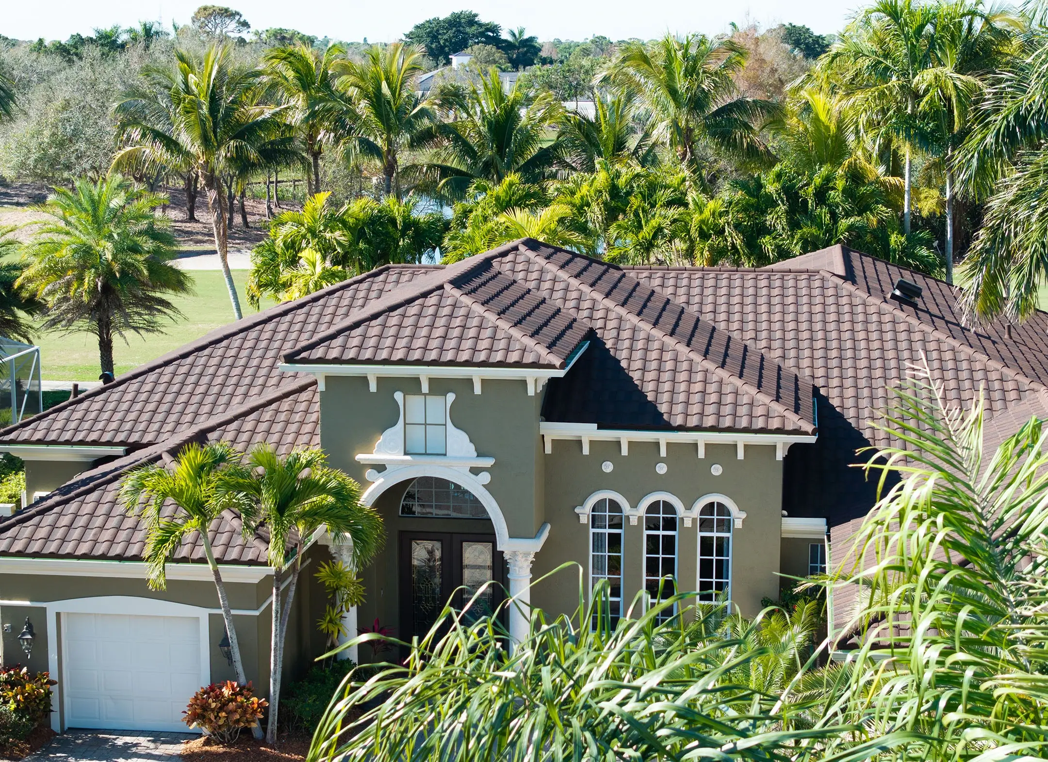 Florida home with a brown spanish tile hip roof