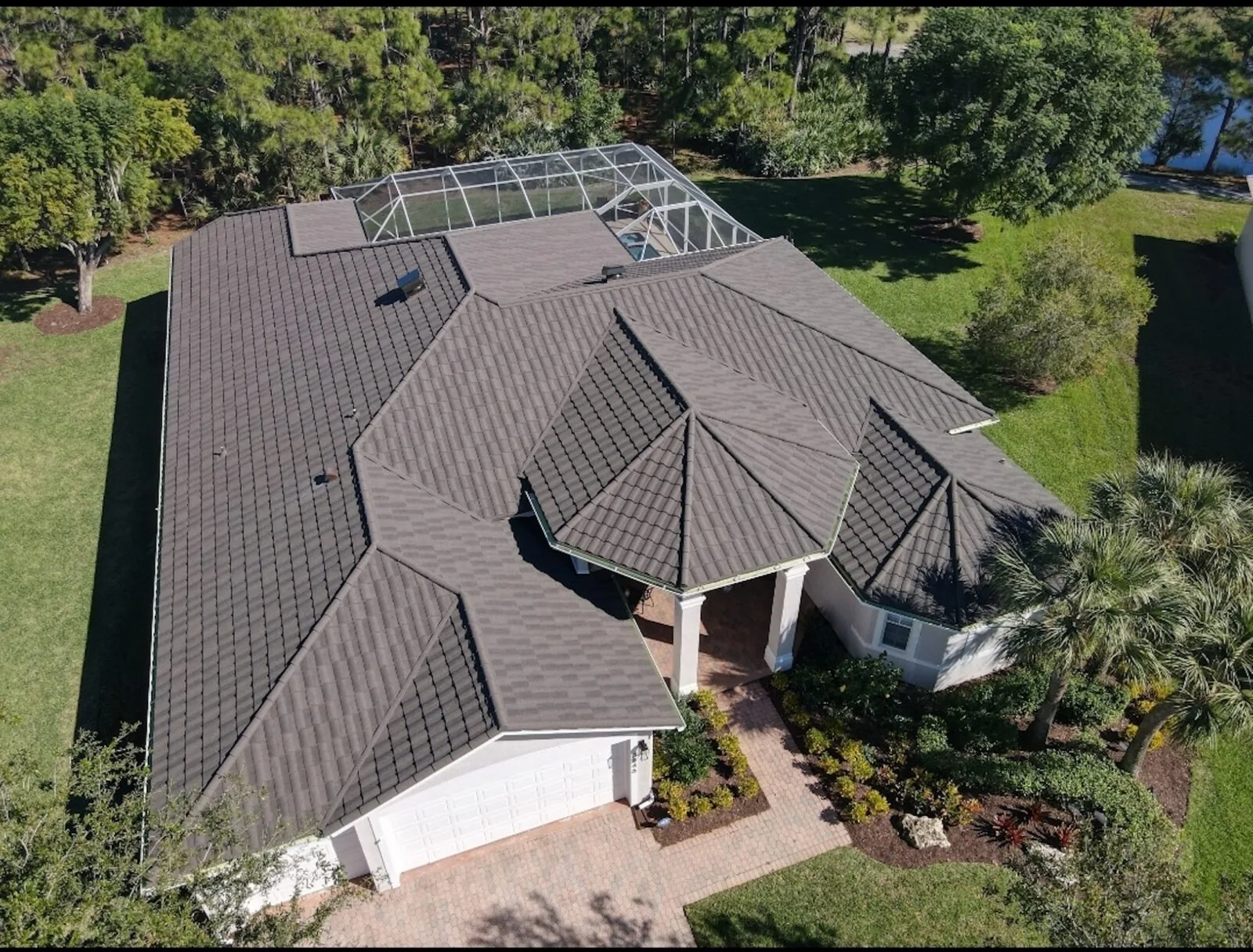 Aerial view of a Florida home with a dark concrete tile roof