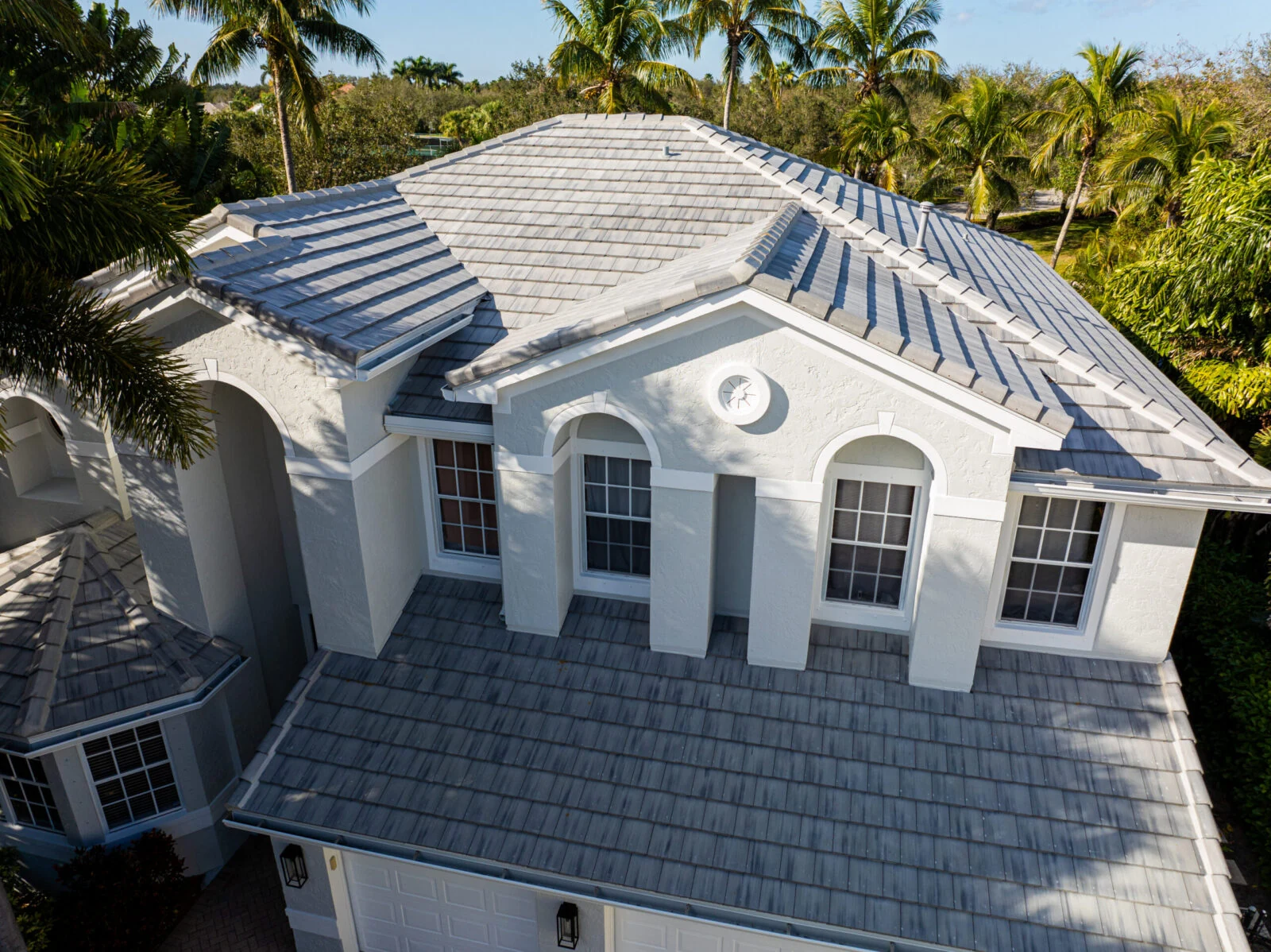 Florida home with a gray concrete tile hip roof
