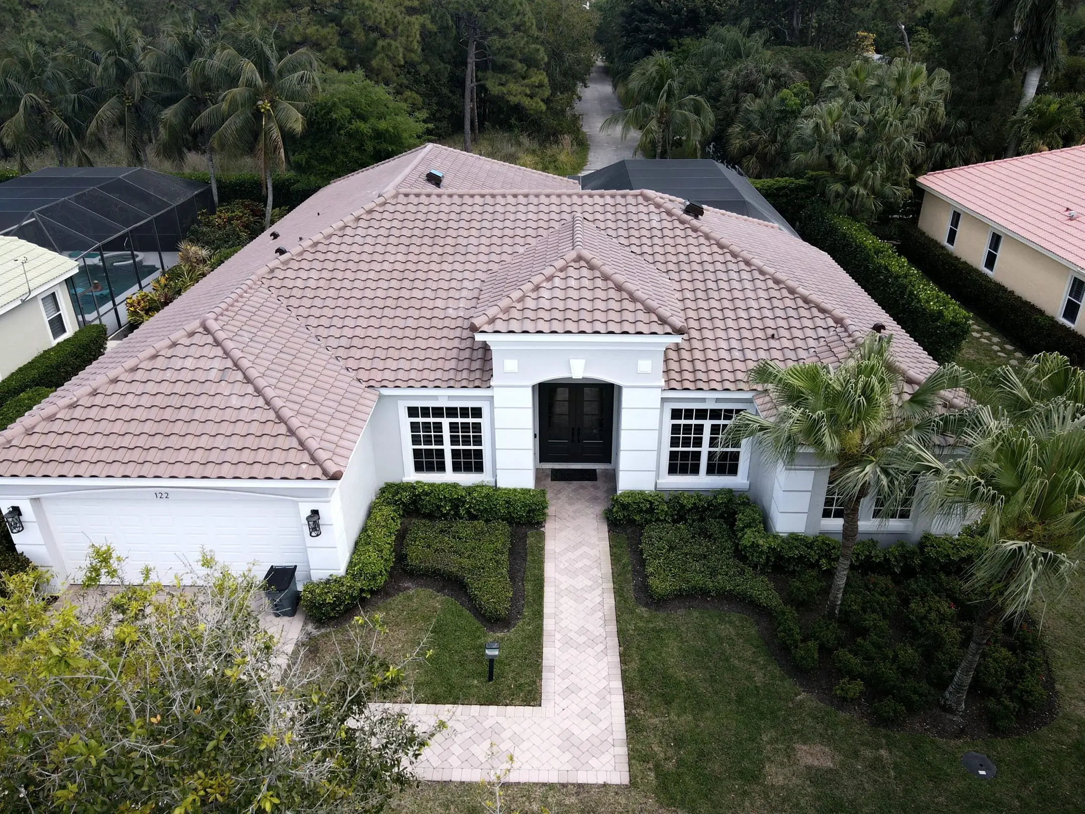 Florida home with a terracotta tile hip roof
