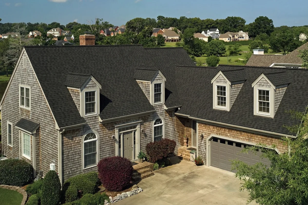 Cape Cod home with Brown roof -- CertainTeed Landmark Pro Max Def Black Walnut (left-34)